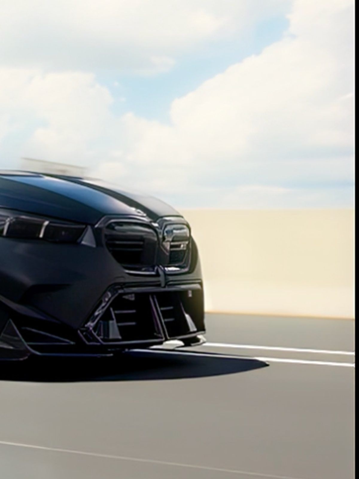 Dark BMW front three-quarter rolling shot
